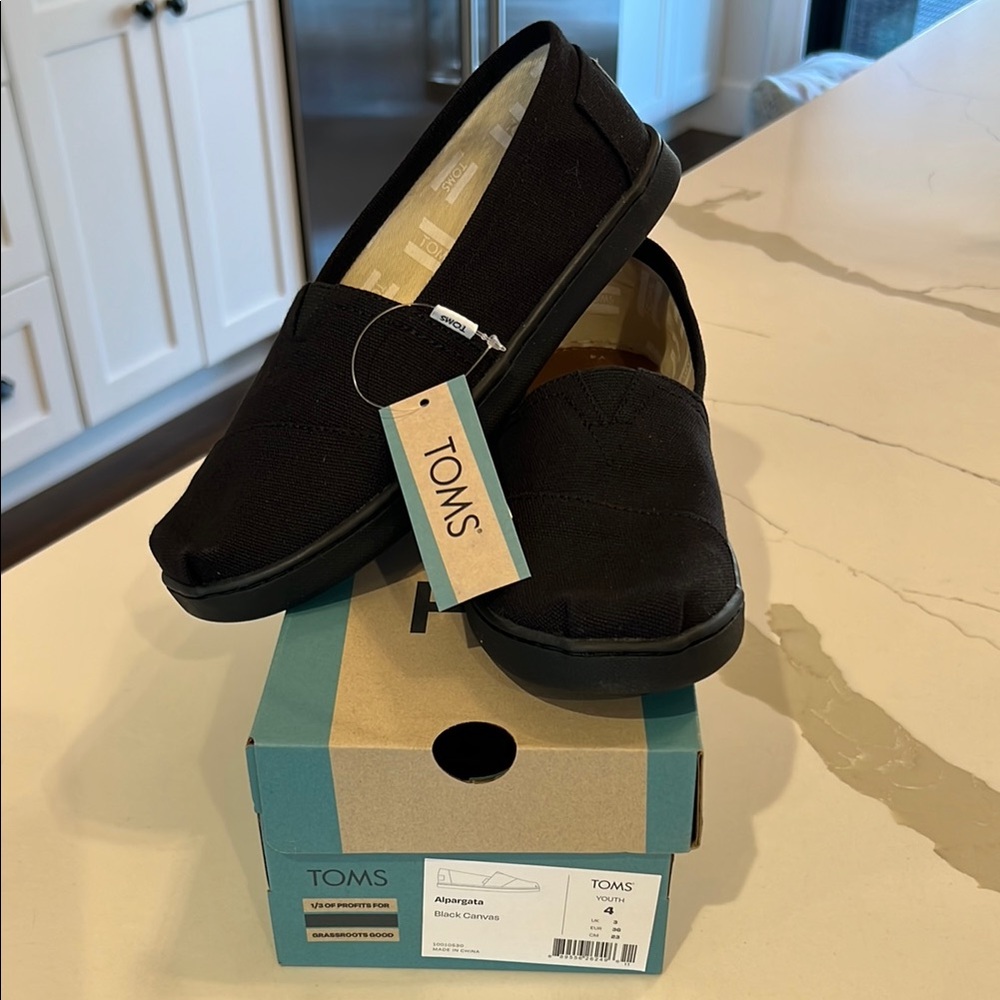 TOMS Black Slip-On Shoes. New!!!!